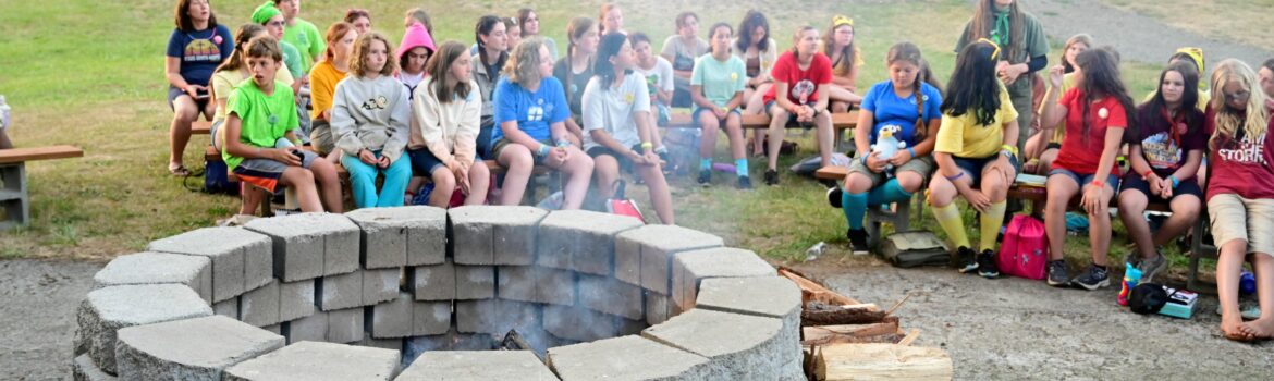 Several campers around a campfire